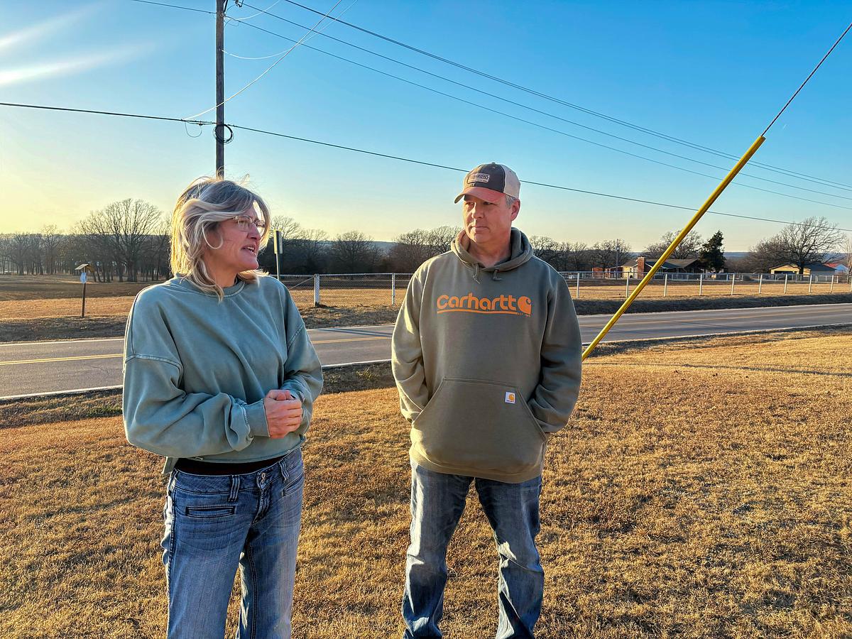 Brian and Chandra Ingram stand outside of their Osage County home in January 2026. The married couple lives outside of Sand Springs city limits due to the city's recent land annexation moves.