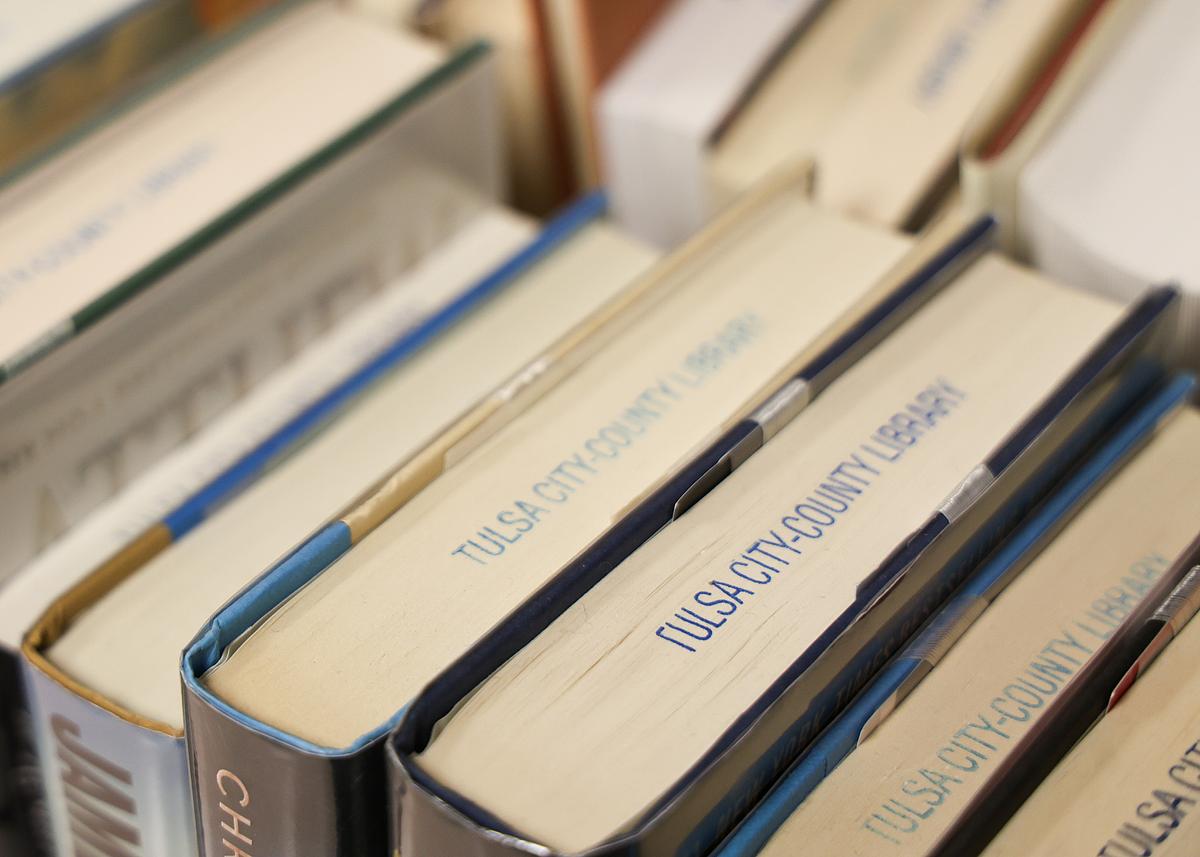 Books sit on a rack at a Tulsa City-County Library  in June 2025.