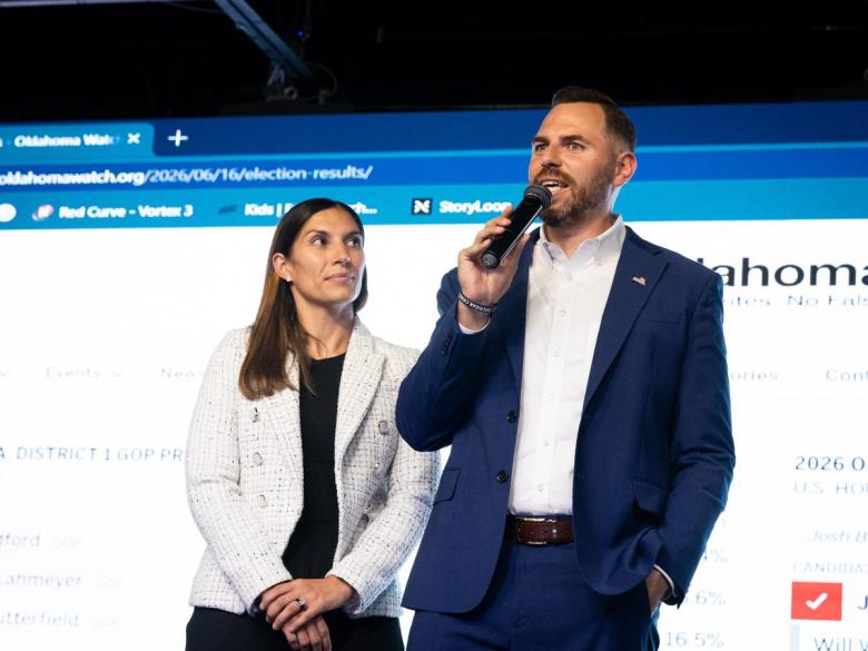 Republican Jackson Lahmeyer speaks to supporters while primary results show he's headed into an August runoff for the US Representative seat on June 16, 2026. His wife, Kendra, joined the Sheridan Church pastor on stage days after a scandal involving him made international news.