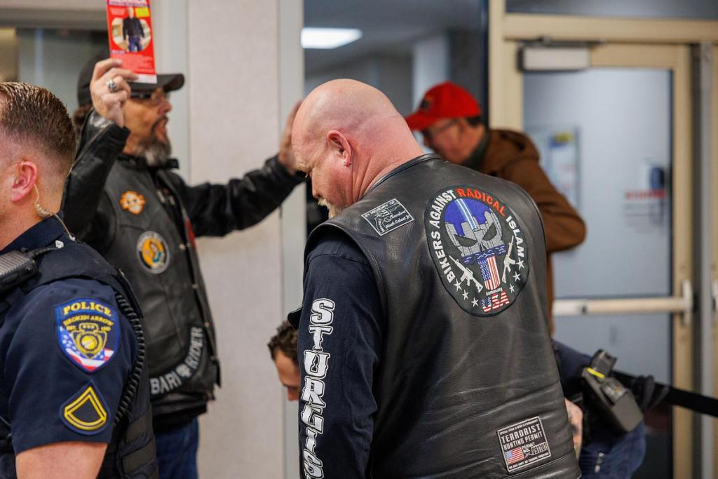 Attendees at a special Broken Arrow City Council meeting on a proposed Islamic mosque pass through security Jan. 12, 2026.