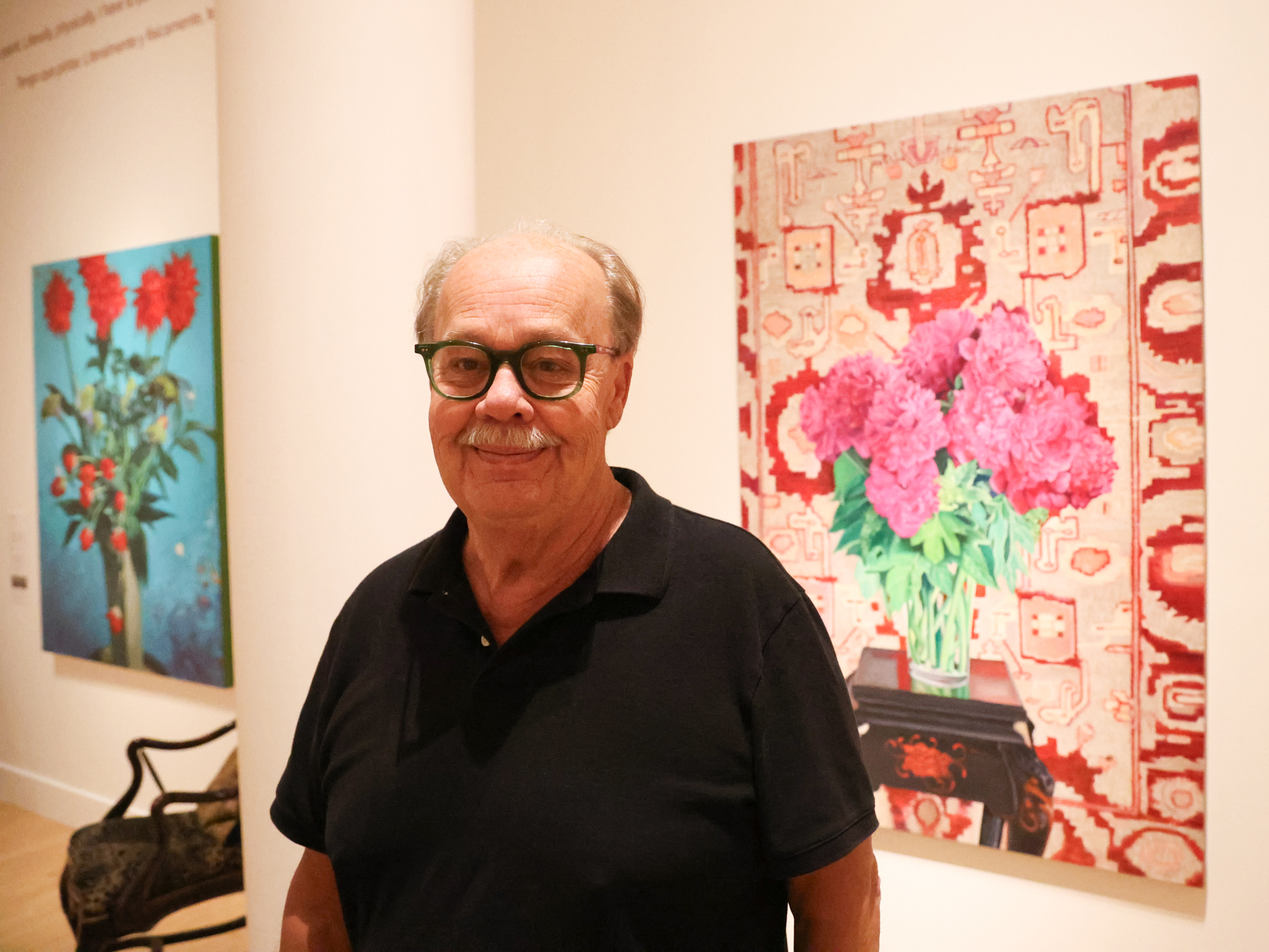 Patrick Gordon standing in front of painting 