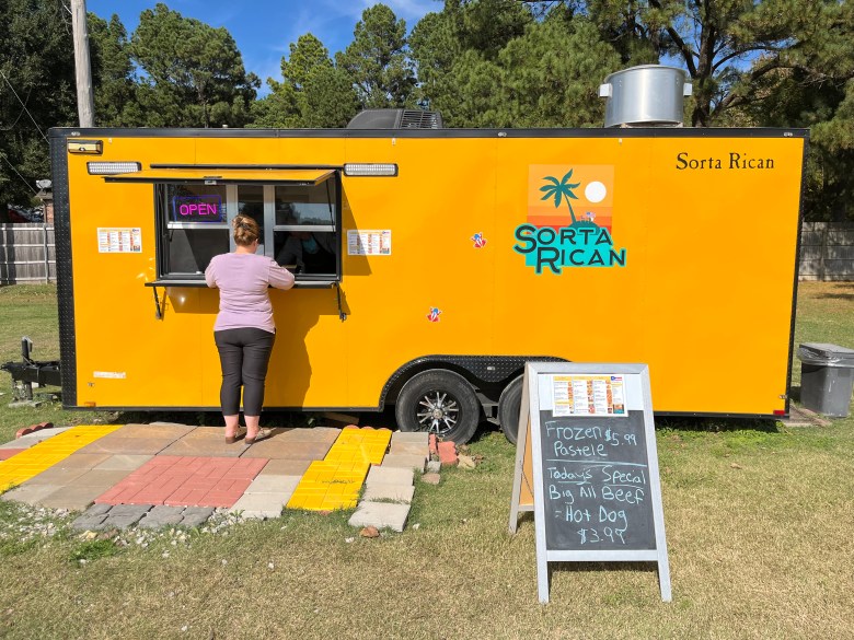 A patron orders lunch from Sorta Rican, a Puerto Rican restaurant in Broken Arrow Oct. 30, 2025.