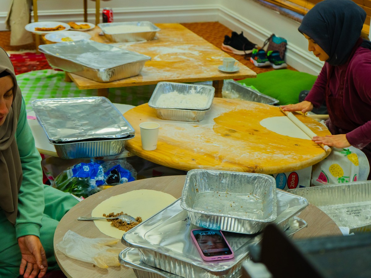 Women prepare food inside the Raindrop Turkish House in Broken Arrow for the Turkish Food and Art Festival on Oct. 25, 2025.