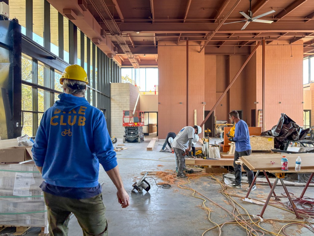 Bike Club co-founder Mike Wozniak tours construction on the club's new 14,000-square-foot headquarters.