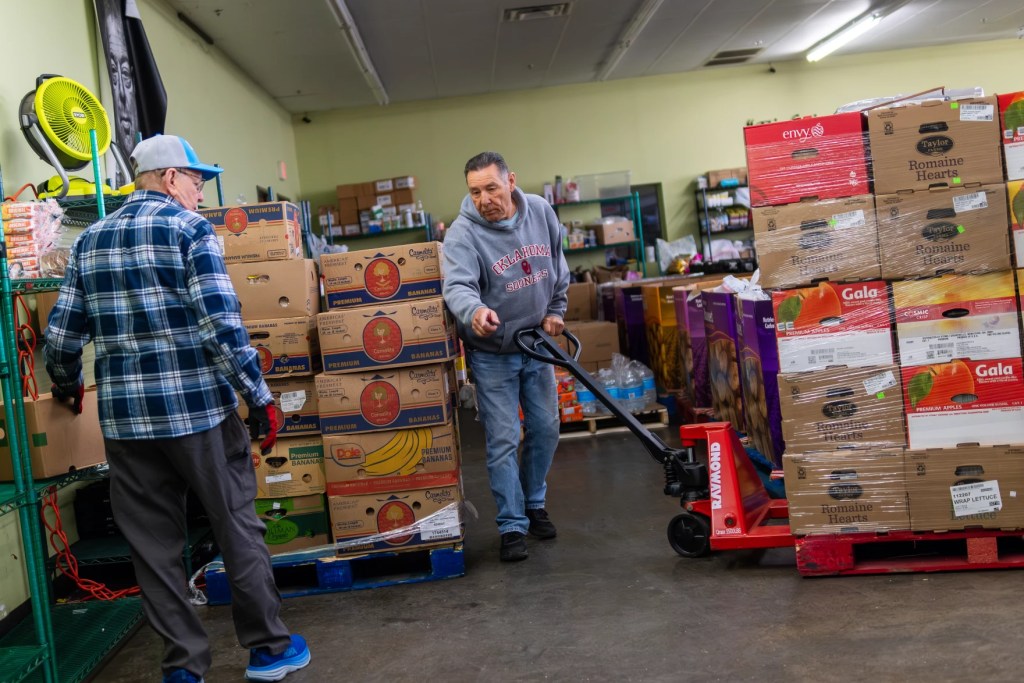 Photo of volunteers organizing shipments of food.