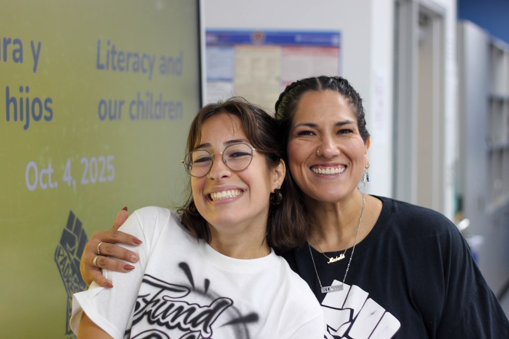 From left to right: Ana Barros, a founding member of Padres Unidos, and Michelle Lara, founding executive director for Padres Unidos, pose for a photo on Oct. 4 at Padres Unidos de Tulsa's Literacy Clinic event