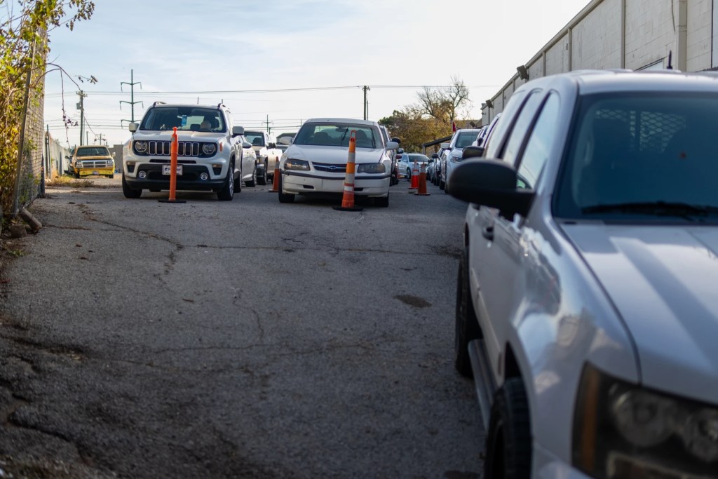 Photo of cars lined up to receive food donations