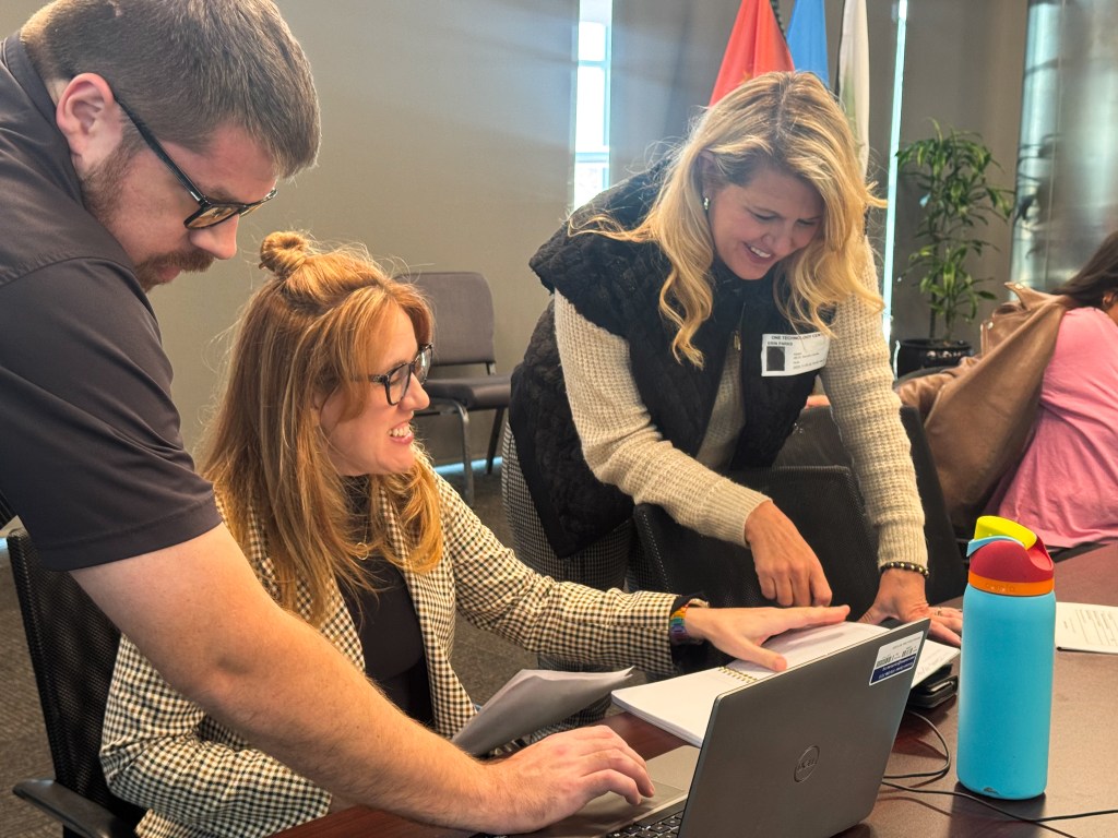 Children's Mental Health Initiative Project Director Amy McGehee, center, works with Erin Parks of Oklahoma’s Parent Network, right, in November 2025.
