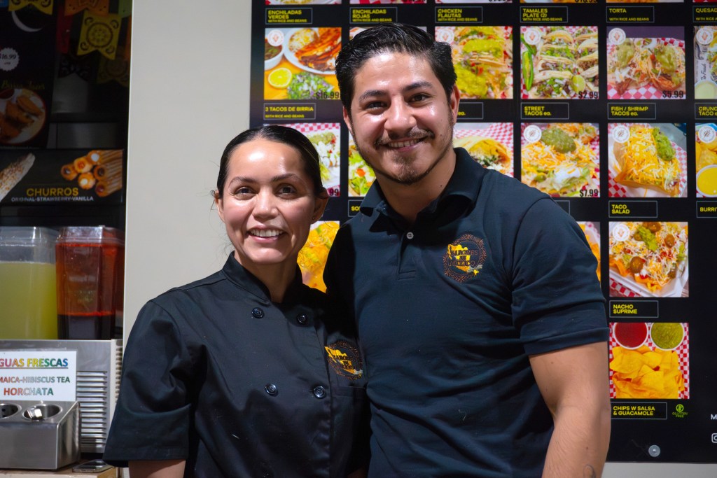 Ricardo Guajardo and Abby Nunez of Sabores de México pose during a El Programa de Lanzamiento graduation celebration at Mother Road Market on Dec. 16, 2025.
