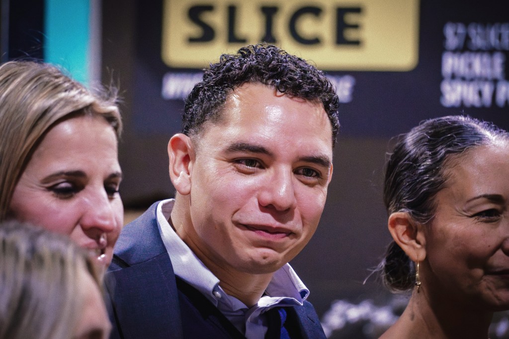 Abel Aguilar, Kitchen 66 program manager, poses during a El Programa de Lanzamiento graduation celebration at Mother Road Market on Dec. 16, 2025.