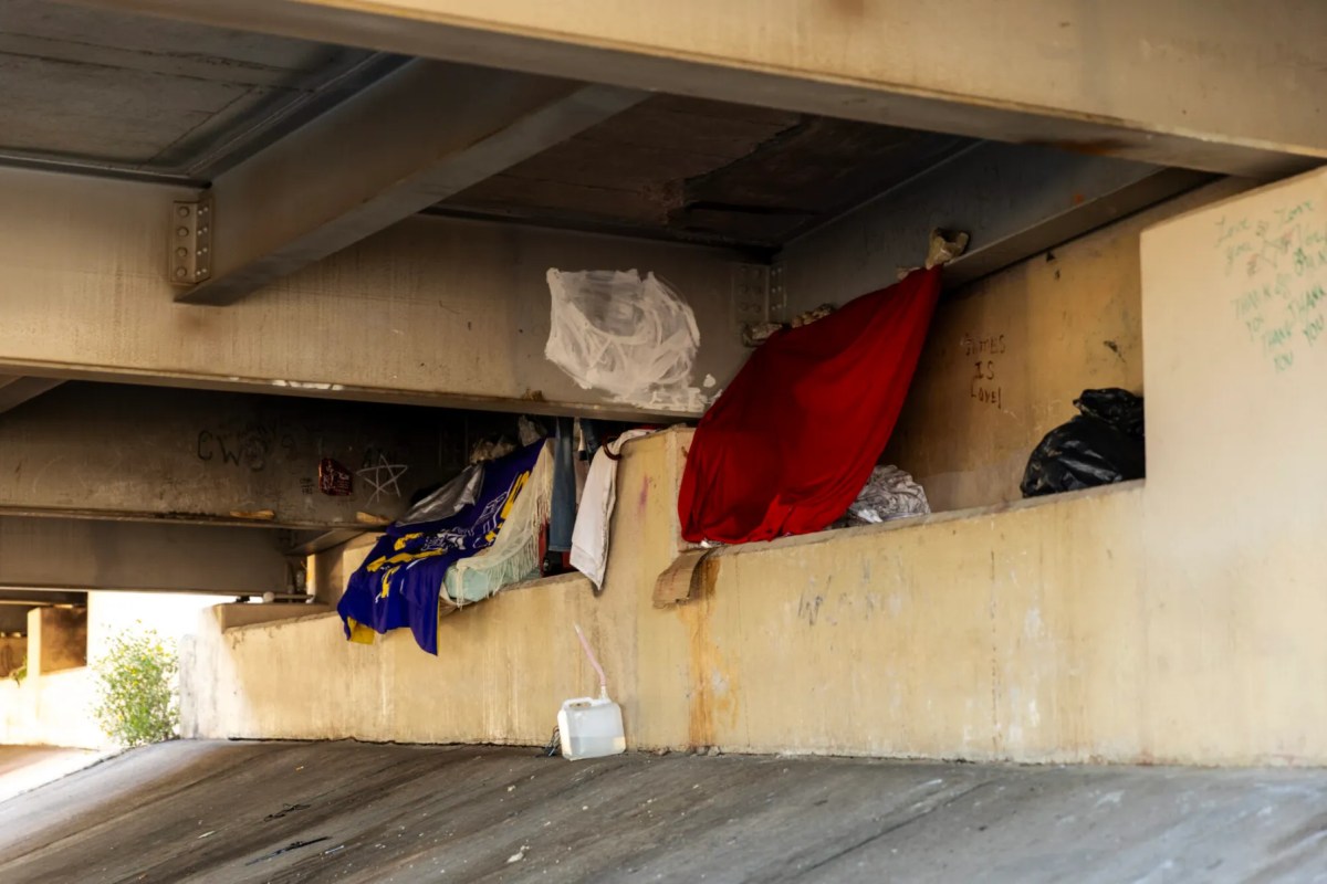 Photo of belongings underneath a bridge