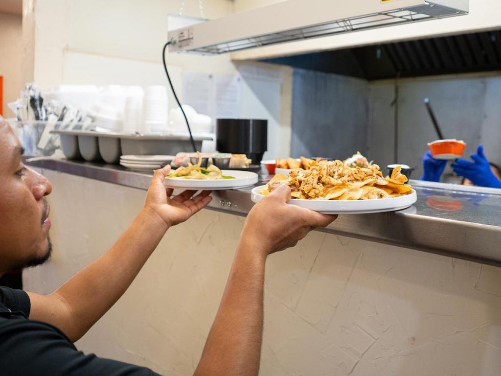 Server picks up food at service window