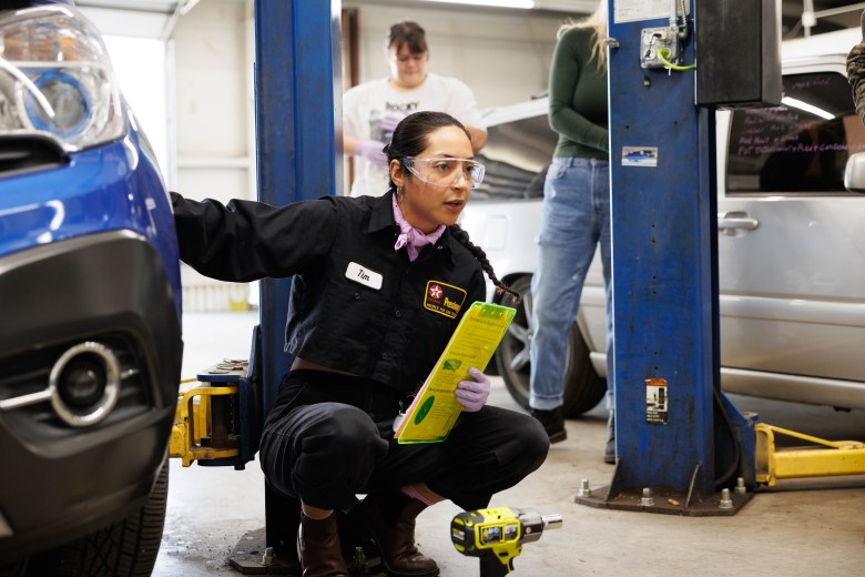 Onyx Montes teaching an auto maintenance workshop