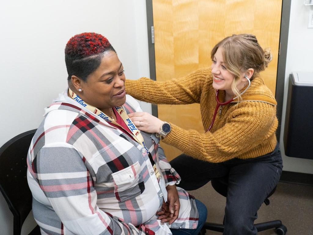 Physician Mackenzie Monigold, right, takes a patient's vitals at a Good Samaritan Health Services walk-in clinic on Dec. 16, 2025.