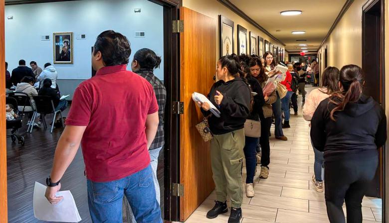 People line up to fill out applications for dual citizenship and wait to speak with staff from the Mexican consulate in Oklahoma City on Dec. 10, 2025, at St. Thomas More Catholic Church in Tulsa.