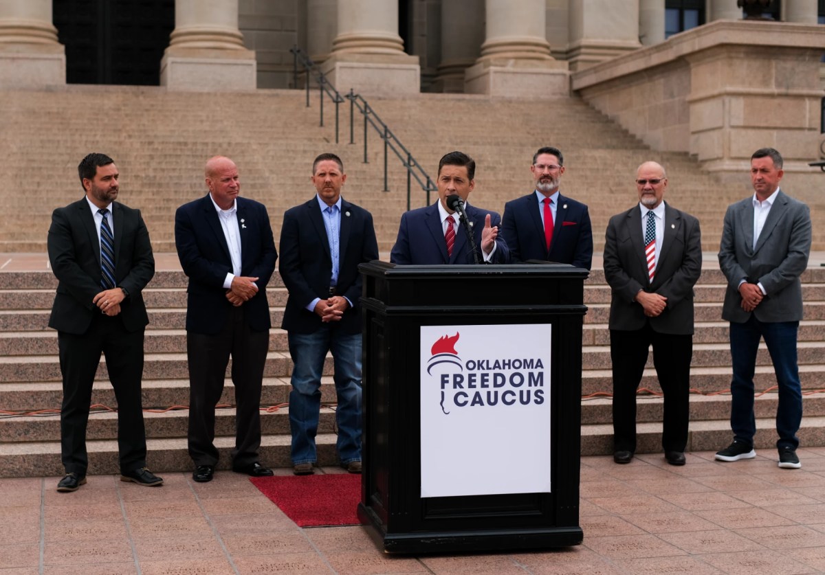 Shawnee Republican Sen. Shane Jett introduces the Freedom Caucus to the Oklahoma legislature with a speech outlining its mission to push the state further to the right, Sept. 3, 2024, outside the Oklahoma State Capitol. Lined up behind Jett, from left to right, are former Sen. Nathan Dahm, R-Broken Arrow; Rep. Jim Olsen, R-Roland; U.S. Representative Josh Brecheen, OK-2; Sen. Dusty Deevers, R-Elgin; Sen. Dana Prieto, R-Tulsa; and Andrew Roth, President of the State Freedom Caucus Network.