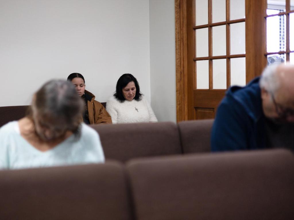 Native Stone Baptist Church congregants pray during service on Jan. 11, 2026. 