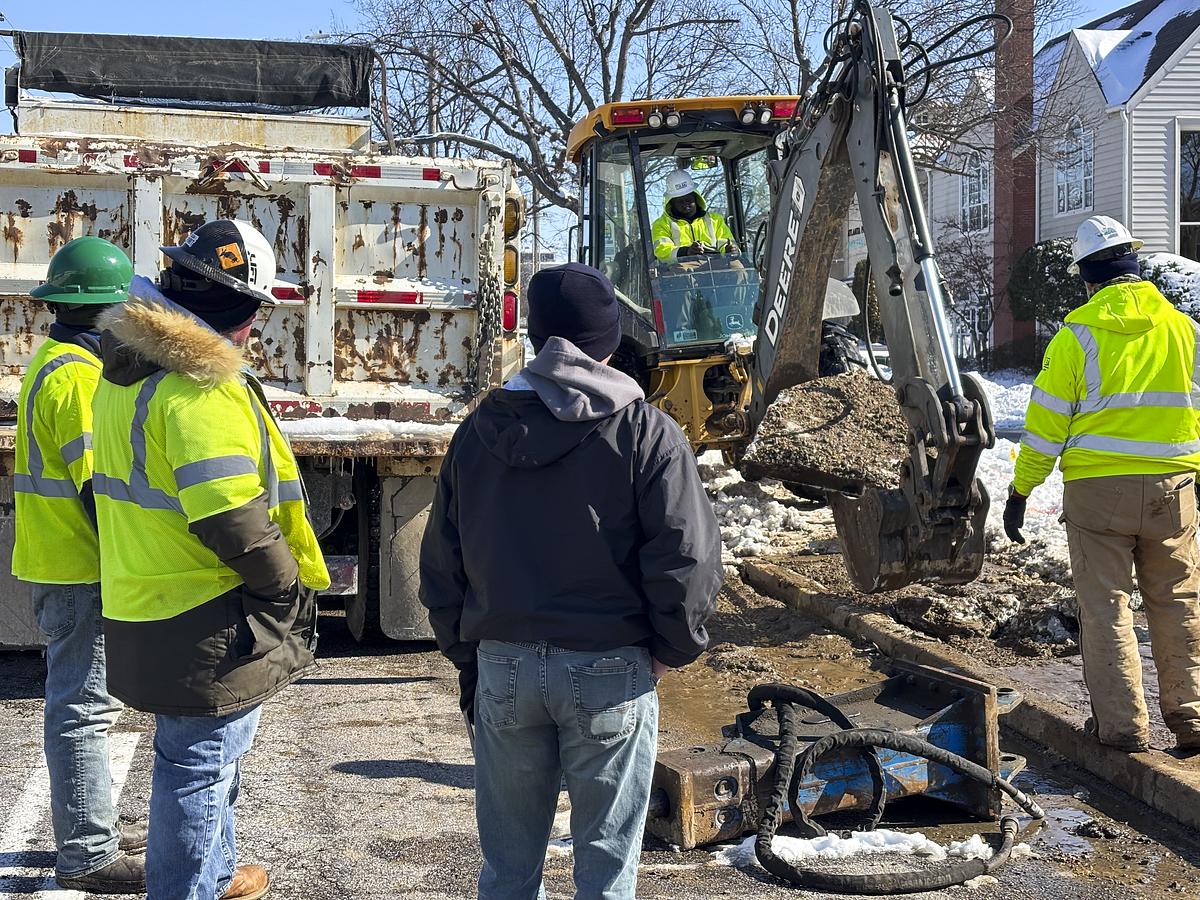 City of Tulsa maintenance crews use an excavator to respond to a water main break on East 21st Street on Jan. 26, 2026.