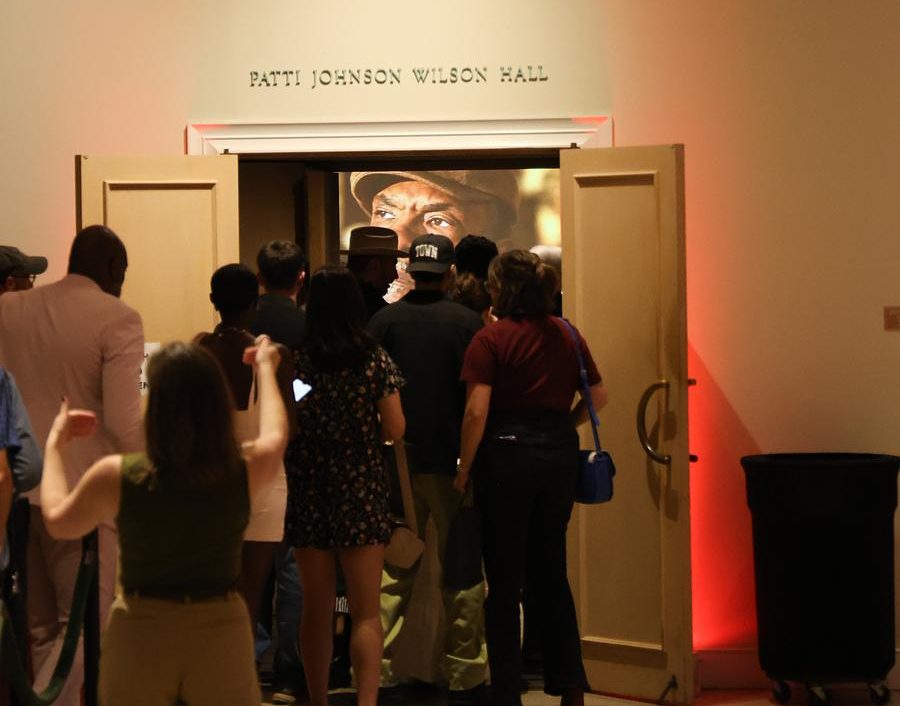 Attendees at the Tulsa premiere of "The Lowdown" enter the Philbrook Museum of Art's theater in September 2025.