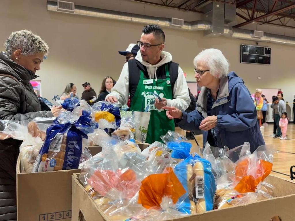 Ramona Owens selects which grocery items she'd like to take home at the Food on the Move grocery giveaway Friday, Jan. 30, 2026. Owens is a life-long west Tulsa resident and remembers when there were four grocery stores in her neighborhood. 