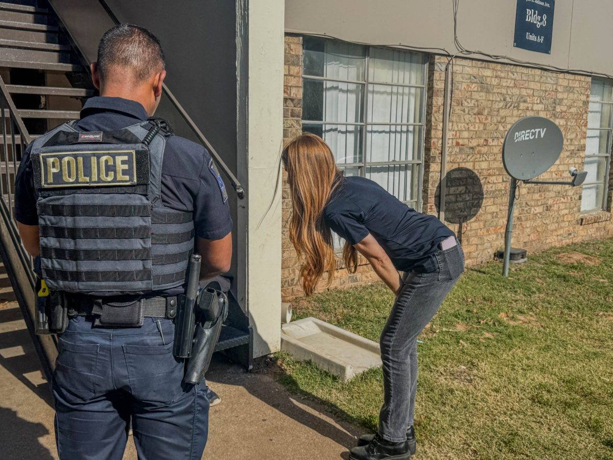 Therapist Amanda Moran and Tulsa Police Officer reassure a 911 caller that they will get help for him.