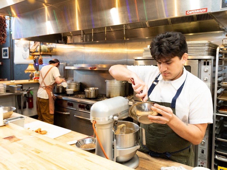 Chef prepares meal in kitchen