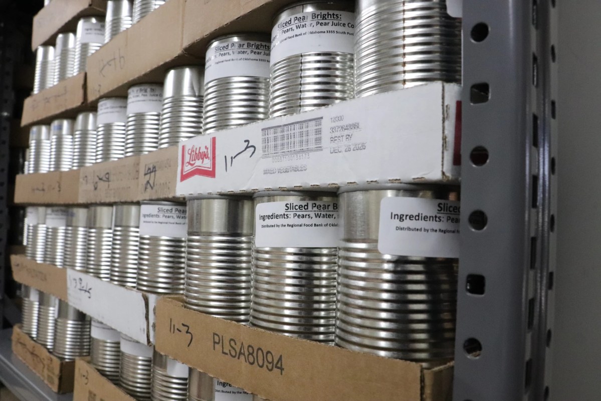 The Mid-Del Food Pantry's shelves stocked with canned goods.