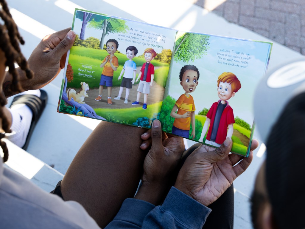 Kentrell Martin and his son KJ Martin Jr. with their newest book