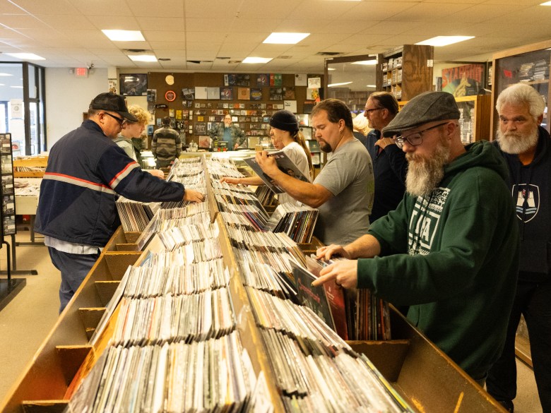 record store customers flip through records
