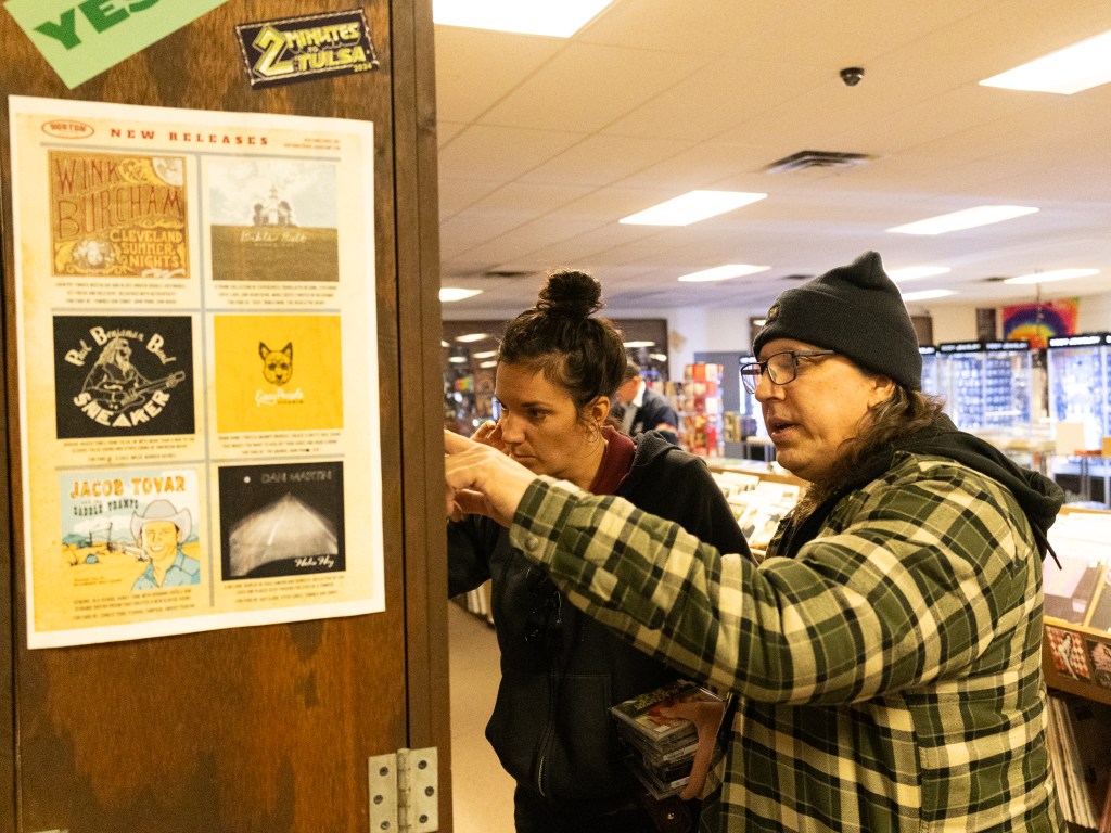 Brian Horton looking at tapes