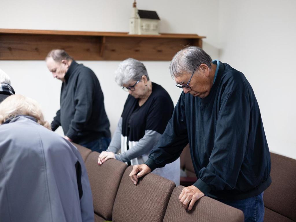 Native Stone Baptist Church congregants pray during service Jan. 11, 2026. 