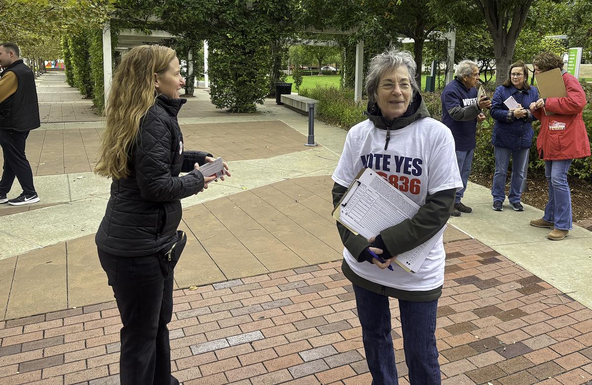 Hayley Walters (left) and Leanne Fish stand outside as they look to engage with Tulsans to garner support for State Question 836 Oct. 30, 2025.