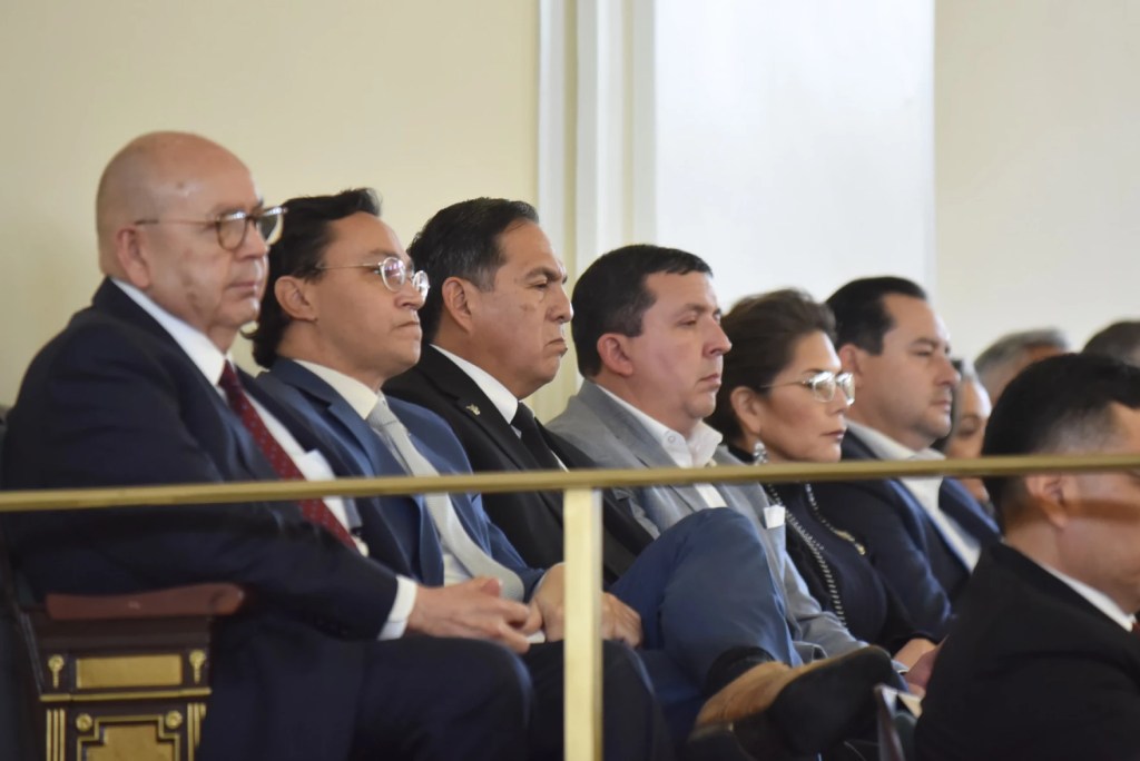 Oklahoma tribal nation leaders watch the Gov. Kevin Stitt's 2024 State of the State address, including (from left) Chickasaw Nation Governor Bill Anoatubby, Cherokee Nation Principal Chief Chuck Hoskin Jr. and Muscogee Nation Principal Chief David Hill.
