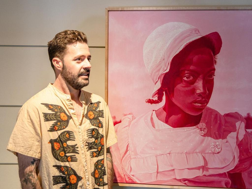 Artist Joel Daniel Phillips stands by his artwork for "Killing the Negative: A Conversation in Art & Verse" at Philbrook Museum of Art. The exhibit runs through May 24. 