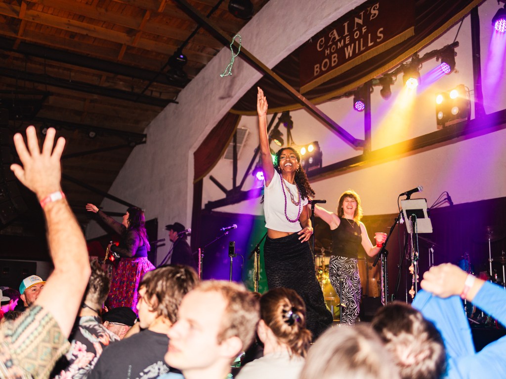 band plays in front of audience