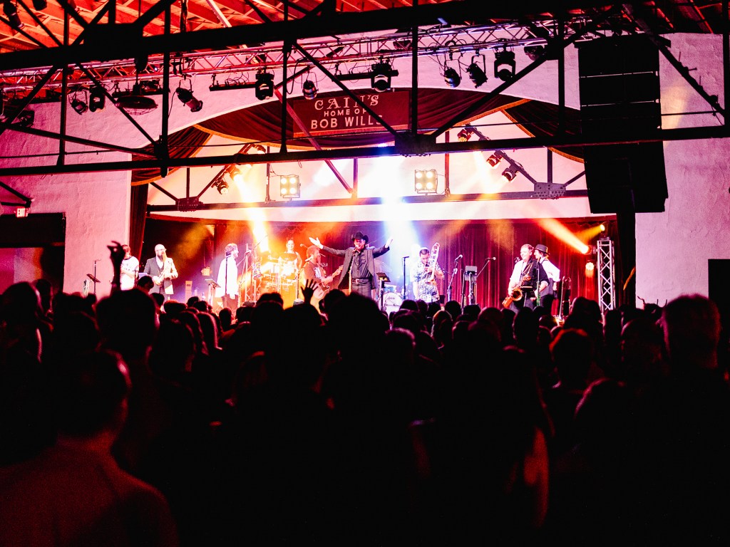 band plays in front of audience