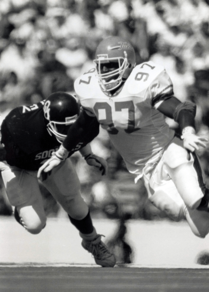 Tulsa's Tracy Scroggins rushes in the backfield against Oklahoma in September 1990.
