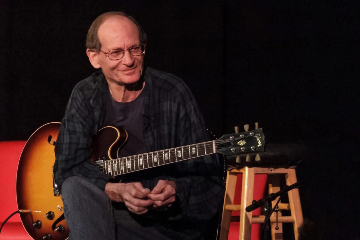 Tommy Crook with guitar