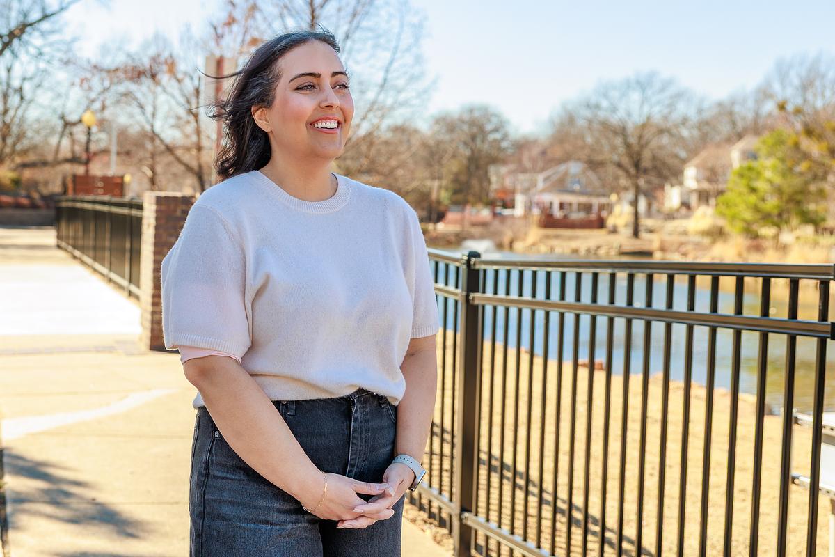 Shagah Zakerion, a 20-year blood cancer survivor and three-time stem cell transplant recipient, stands at Swan Lake while speaking about her cancer journey Feb. 26, 2026. “Please don’t make me look sad. Why would I be sad? I am alive!” she said.