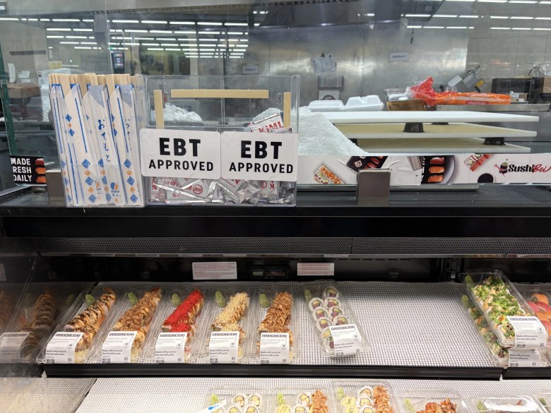 An Electronic Benefits Transfer (EBT) Approved sign is posted at an Oklahoma City grocery store.