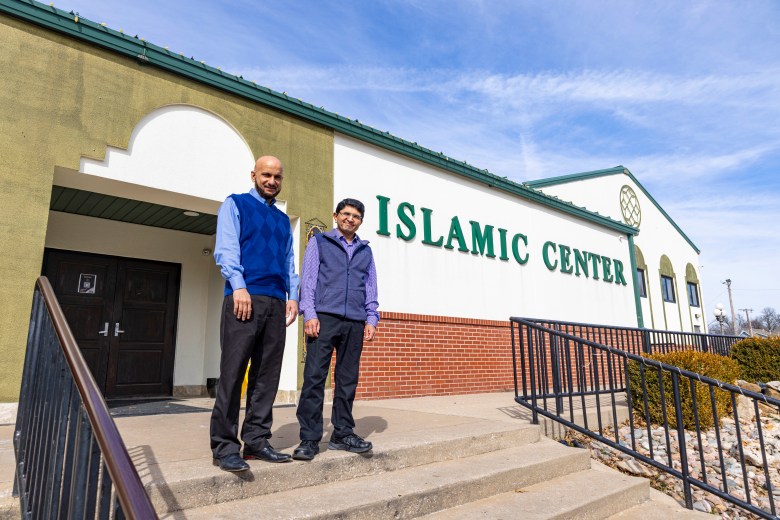 men standing outside Islamic Society of Tulsa building