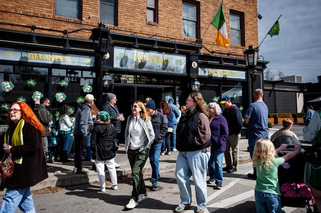 Tulsans wait in line during the St. Patrick’s Day celebration outside Killkenny's Irish Pub March 17, 2026. The block party included multiple bars, children's activities, music and more.