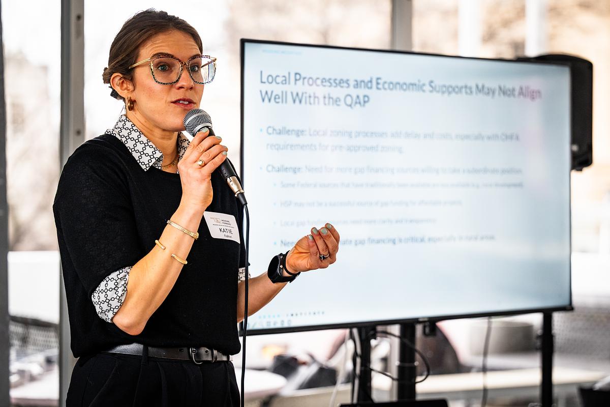 Katie Fallon, a researcher with the Urban Institute,  peaks during a Housing Forward presentation on March 5, 2026. Researchers spoke about ways to improve options for affordable housing in Tulsa.