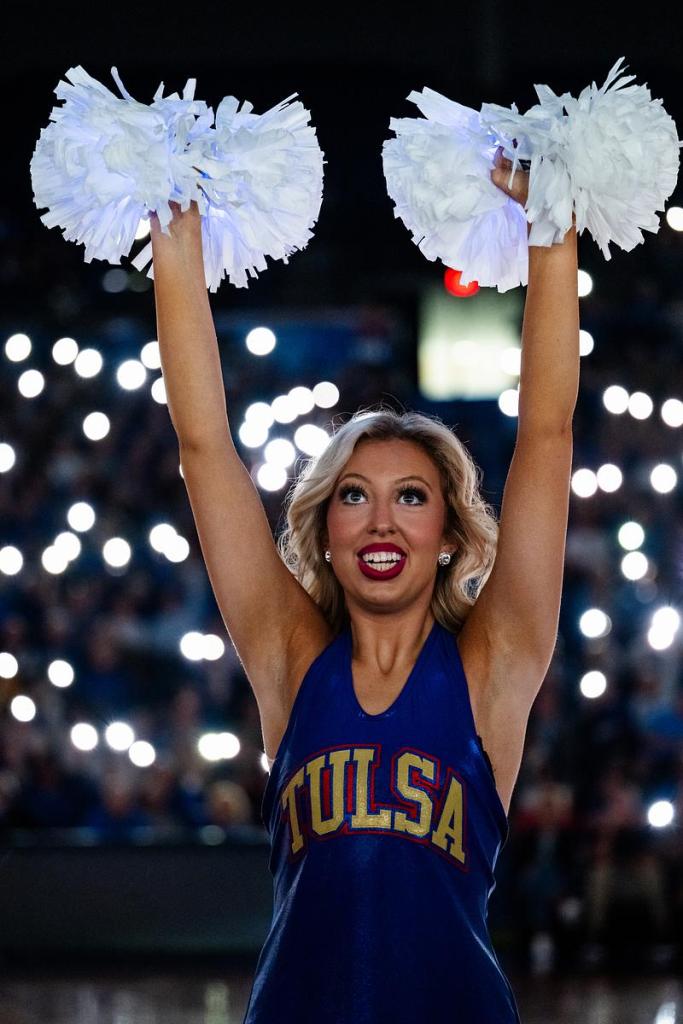 A University of Tulsa cheerleader performs during their game at the Donald Reynolds Center on Tuesday, March 24, 2026. 