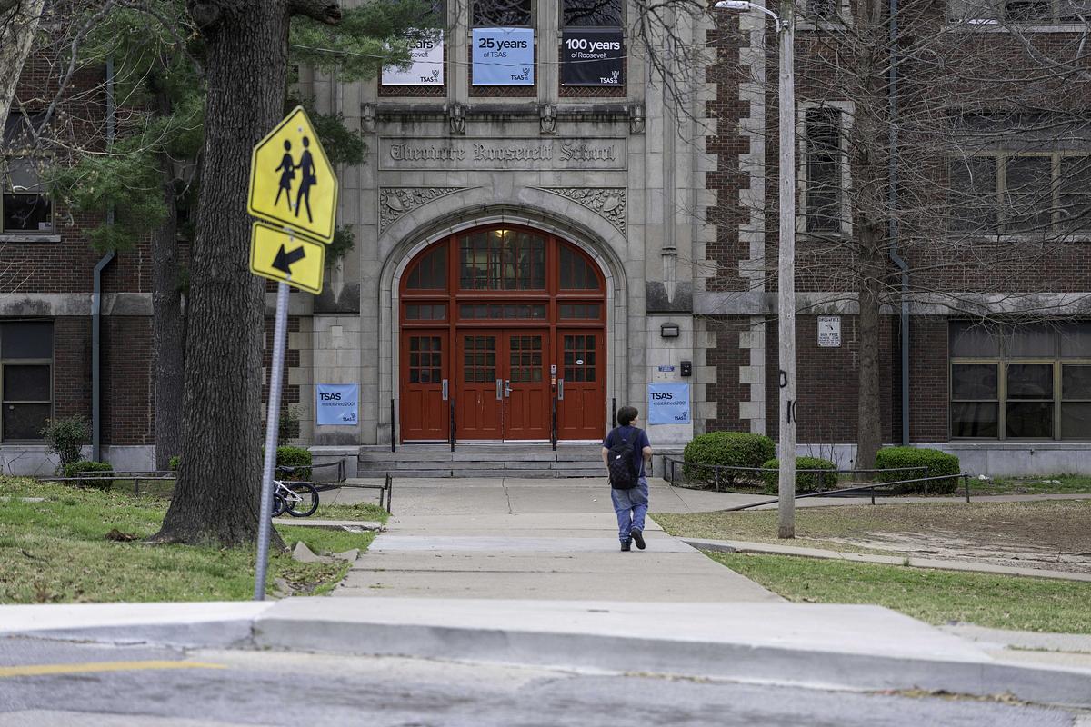 A student walks into the Tulsa School of Arts and Sciences (the former Theodore Roosevelt School) on March 24, 2026.