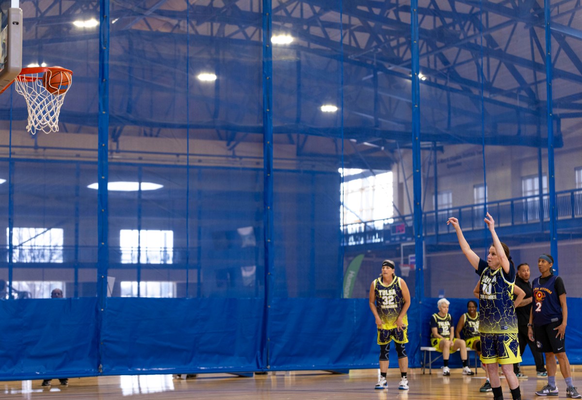 athletes compete in basketball game