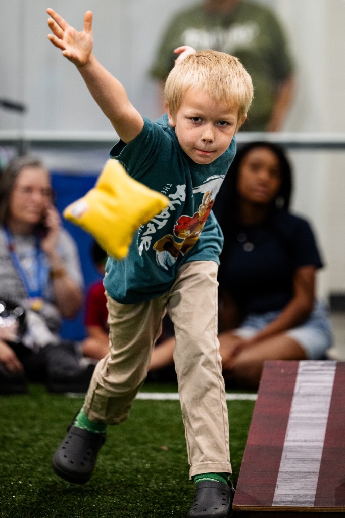 Levi Hillstead throws a bean bag during a Special Olympics Unified Cornhole Tournament at Tulsa's Nathan Hale High School March 26, 2026.