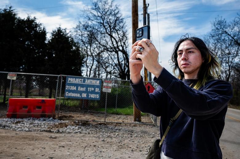 Joseph Bañuelos takes a video of the Project Anthem construction site on March 23, 2026. Bañuelos is an east Tulsan who believes data centers such as Project Anthem don't have anything to offer the city that it can't already provide for itself.