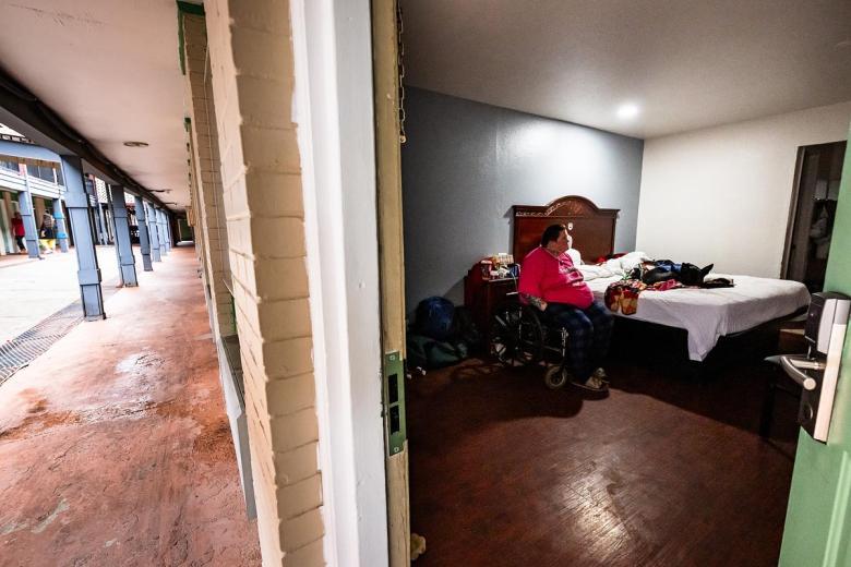 Suzanne Stephens sits with her dog Sage in her motel room at Rest Inn & Suites March 10, 2026. Stephens has spent the past two years unhoused due to medical difficulties and recently moved into the motel with help from the Tulsa Day Center. Her animals are the most important thing to her.