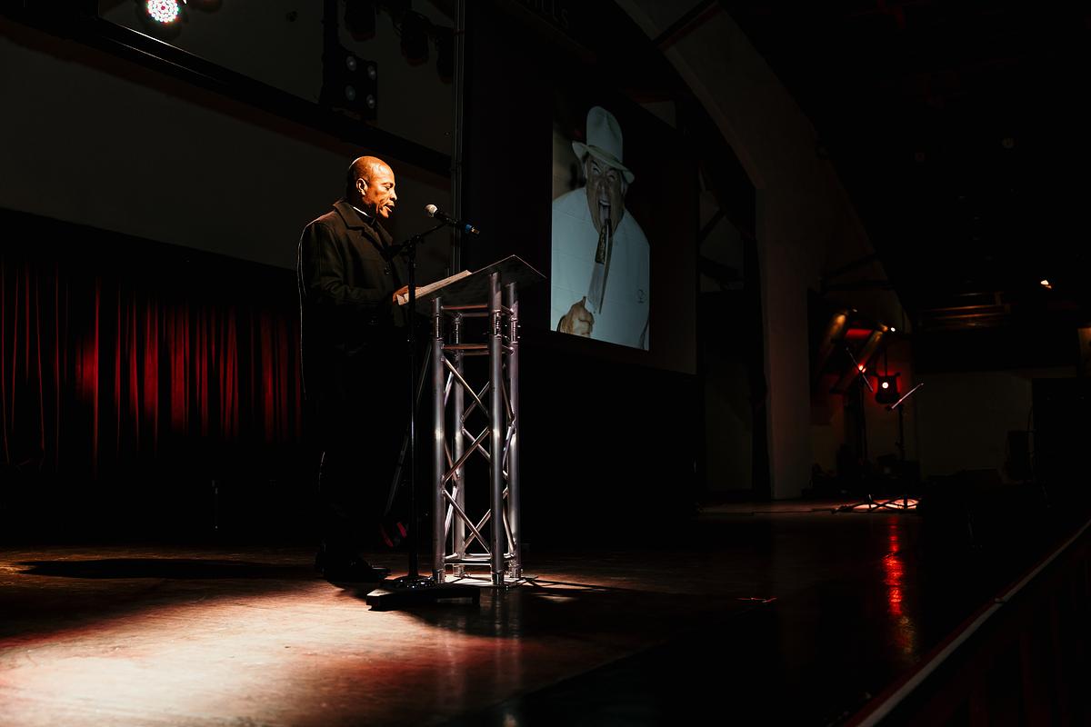 Rev. Kenneth Iheanacho speaks during a celebration of life for Vincent “Buzz” Dalesandro III at Cain’s Ballroom March 17, 2026. Dalesandro, a longtime Tulsa chef and restaurateur, founded Dalesandro's Italian Cuisine in 1990.